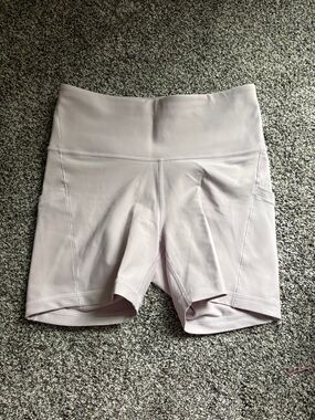 Athleta light pink biker shorts with pockets